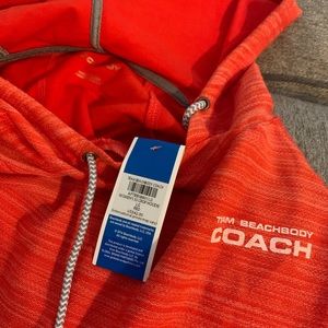 Bright orange bb coach thick shirt with hoodie.